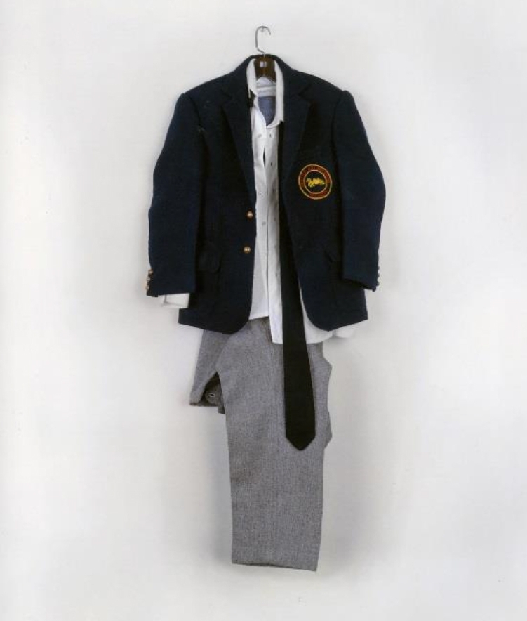 LeDray is particularly interested in the subject of male identity and uses clothing as a stand-in for the archetypical male. There&rsquo;s the family man, the military man, the businessman, and worker.&nbsp;S.A.M.&nbsp;(1994) consists of gray pants on a hanger with a white dress shirt, tie, and blue blazer draped over top. Stitched onto an outside pocket of the blazer is a round patch declaring the uniform as belonging to a member of &ldquo;Seattle Art Museum Security&rdquo; &ndash; LeDray once worked at the museum as a guard.